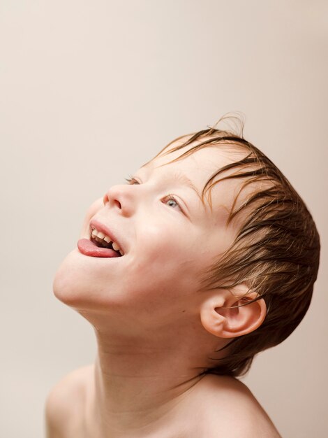 Playful boy bathing