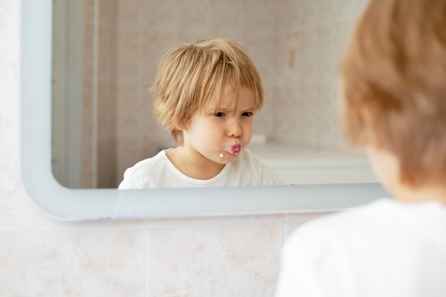 Playful boy in bathroom