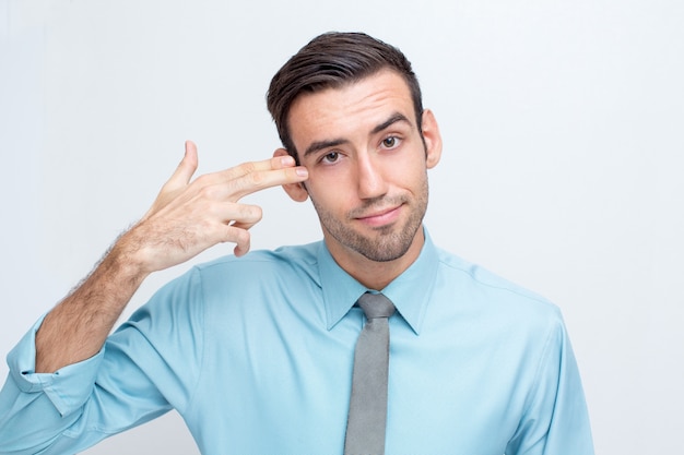 Playful Business Man Shooting Himself With Fingers