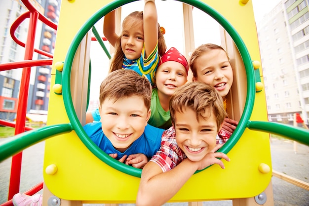 Playful classmates having fun on playground