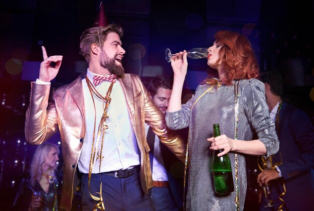 Playful couple enjoying during new year's party