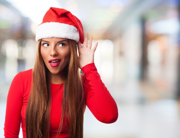 Playful girl with santa claus hat