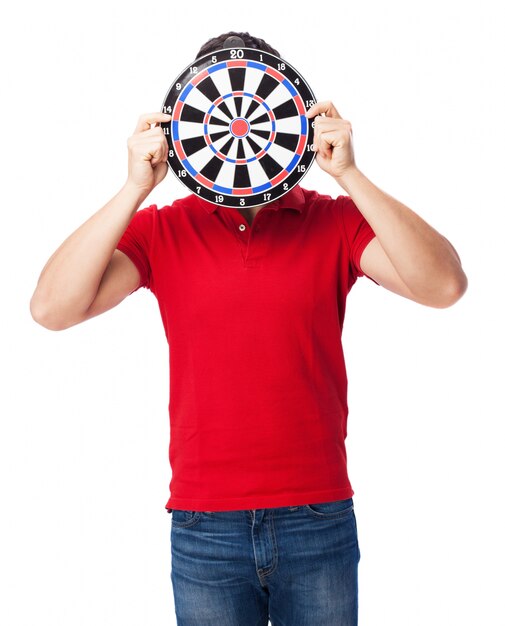 Playful guy with a dartboard on his face