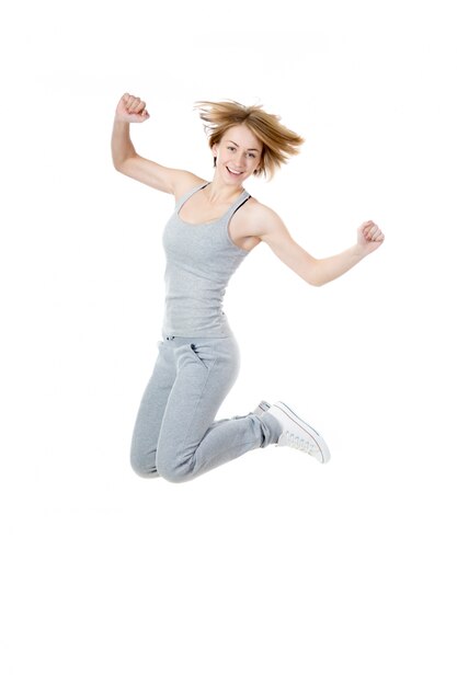 Playful sportswoman jumping