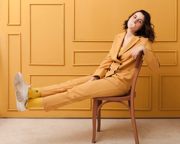 Playful woman on chair