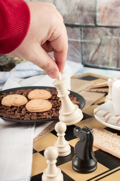 Playing chess on a tea cookie table