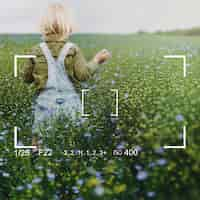 Free photo playing in a field of flowers