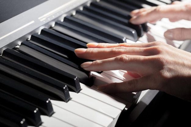 Playing piano close up