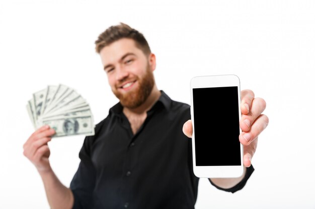 Pleased bearded business man in shirt holding money