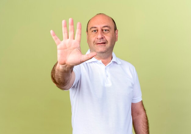 Free photo pleased mature man showing five