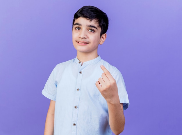 Pleased young caucasian boy looking at camera pointing at himself isolated on purple background with copy space