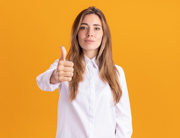 Pleased young pretty caucasian girl thumbs up