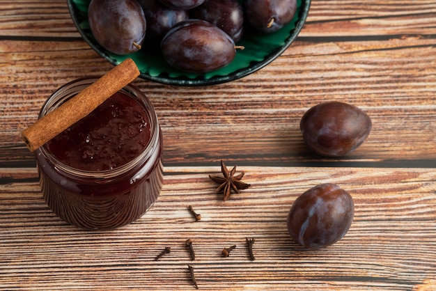 Plum confiture with fruits on the table.