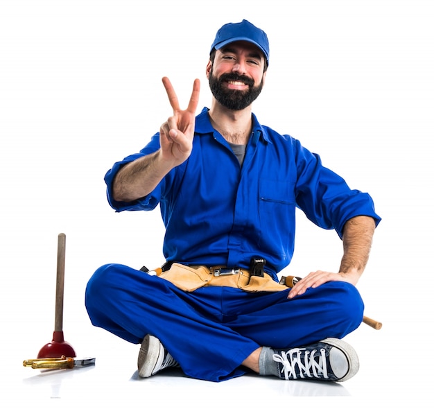 Free photo plumber doing victory gesture