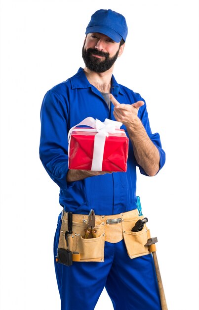 Plumber holding a gift