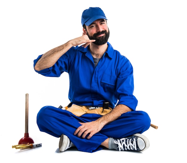 Plumber making phone gesture