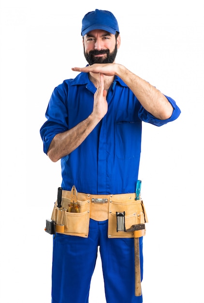 Free photo plumber making time out gesture