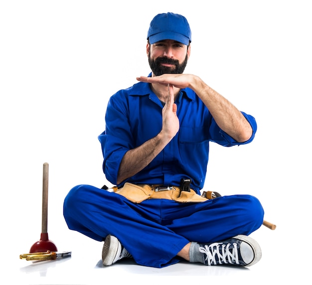 Plumber making time out gesture