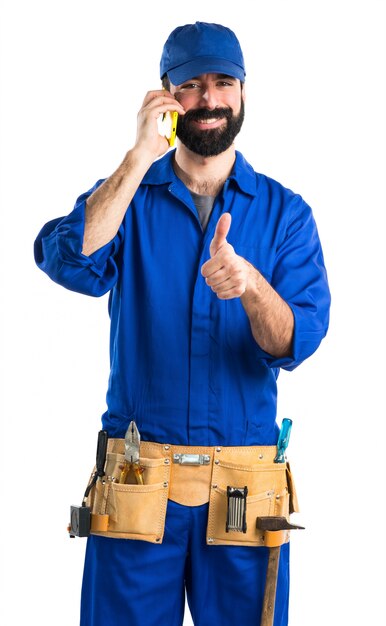 Plumber talking to mobile