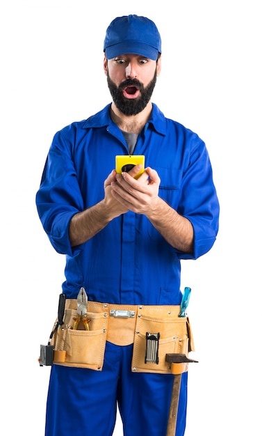 Plumber talking to mobile