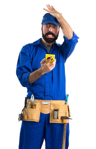 Plumber talking to mobile