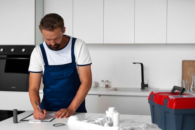 Free photo plumbing professional doing his job