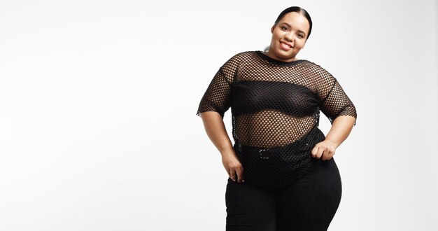 Plus size model in studio shoot happy smiling