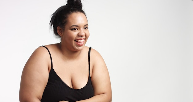 Free photo plus size model in studio shoot happy smiling