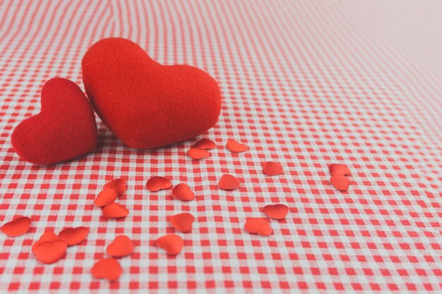 Plush hearts on a checkered tablecloth