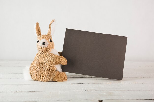 Plush rabbit with black paper