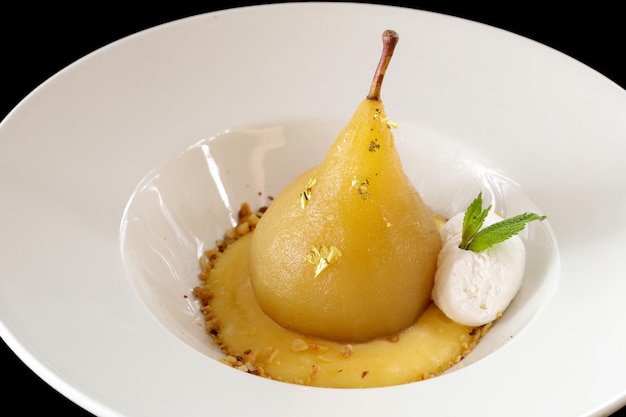 Poached pear with vanilla ice cream
