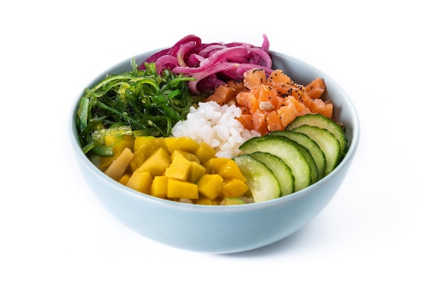 Poke bowl with rice salmoncucumbermangoonionwakame salad poppy seeds ands sunflowers seeds