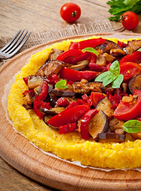 Polenta with vegetables - corn grits pizza with tomato and eggplant