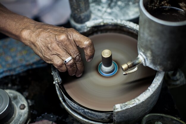  Polishing moonstone at the factory for the extraction and processing of precious stones.