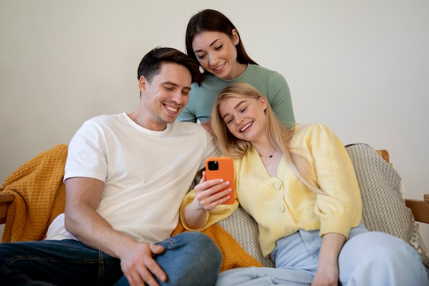 Polyamorous partners with smartphone