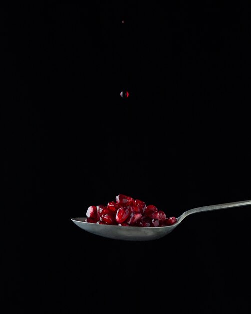 Pomegranate on spoon