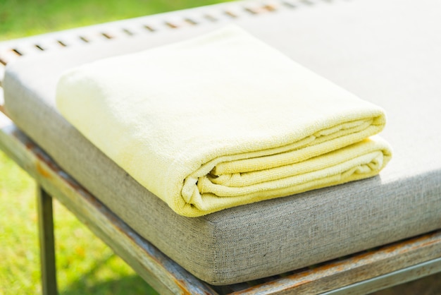 Free photo pool towel on chair in luxury hotel resort