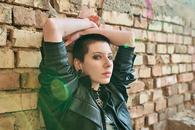 Pop punk aesthetic portrait of woman posing inside building