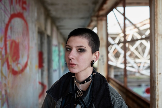 Pop punk aesthetic portrait of woman posing inside building