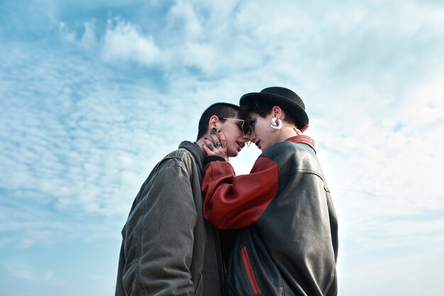 Pop punk aesthetic portrait of women posing and kissing