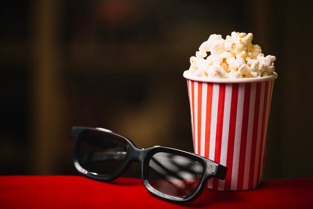 Popcorn bucket and 3D glasses in cinema