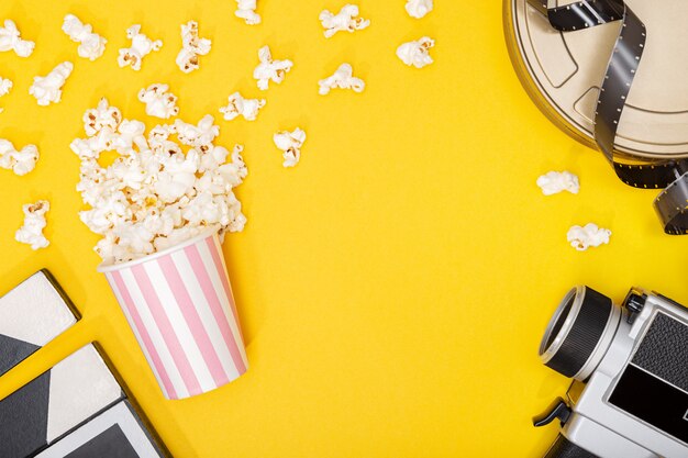 Download Premium Photo Popcorn Bucket On Yellow Background Movie Or Tv Background Top View Copy Space Yellowimages Mockups