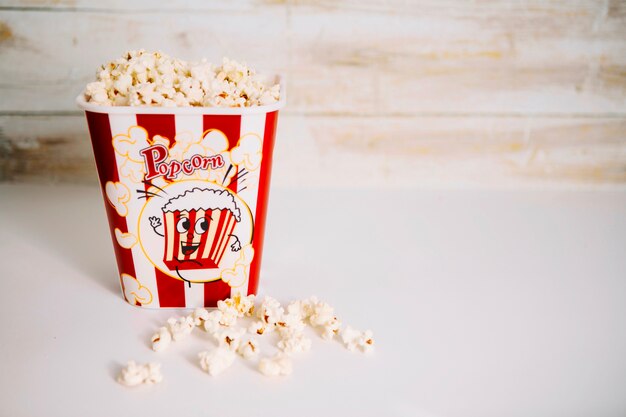 Popcorn bucket near wooden wall