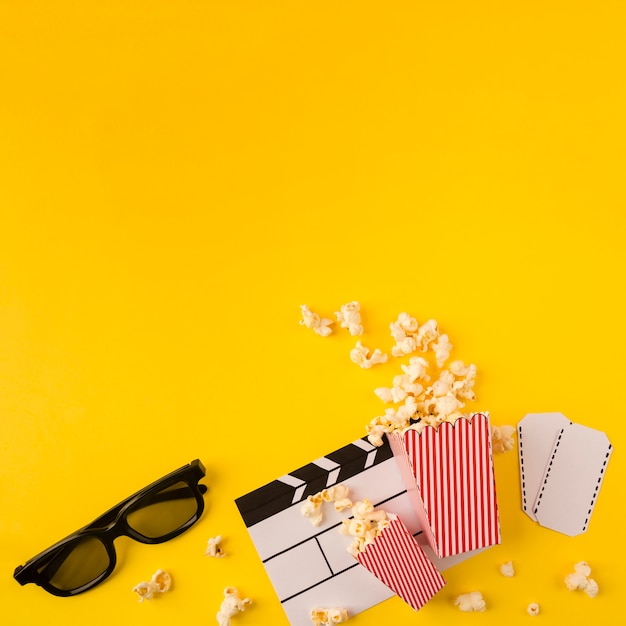 Popcorn composition on yellow background with copy space