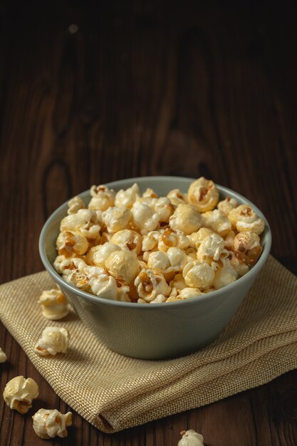 Popcorn on the wooden table.