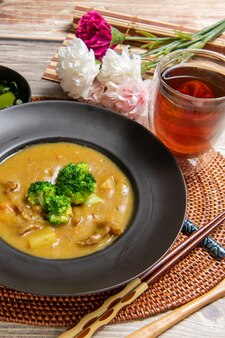 Pork curry rice on wooden background (table decoration)