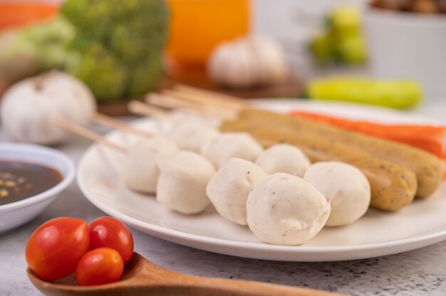 Pork meatballs on a white plate.