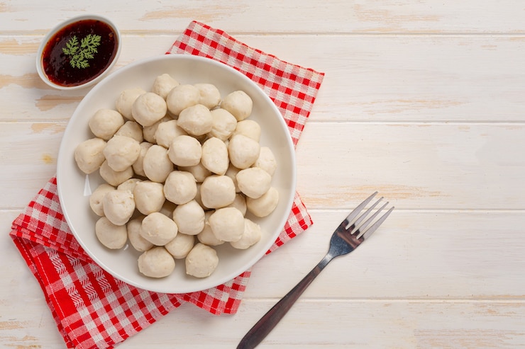 Free Photo pork meatballs on the white wooden surface.