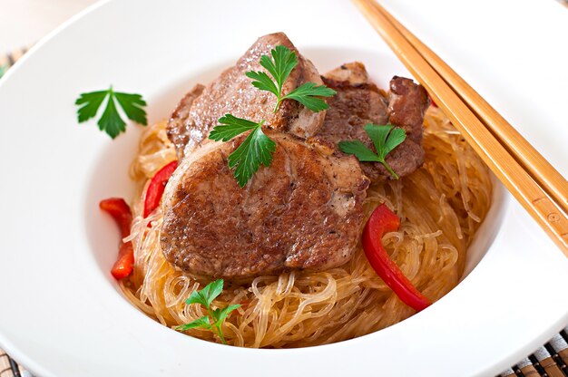 Pork medallions in oyster sauce with noodles