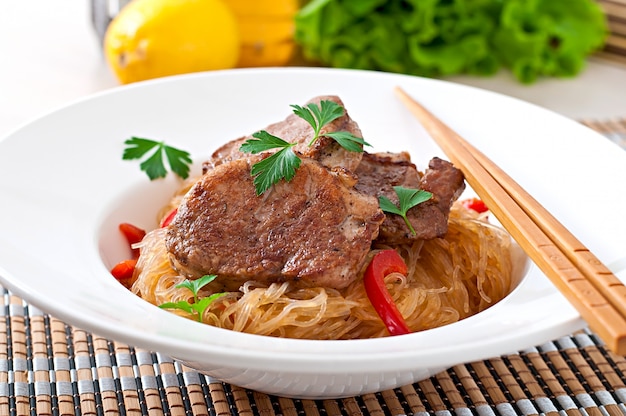 Pork medallions in oyster sauce with noodles